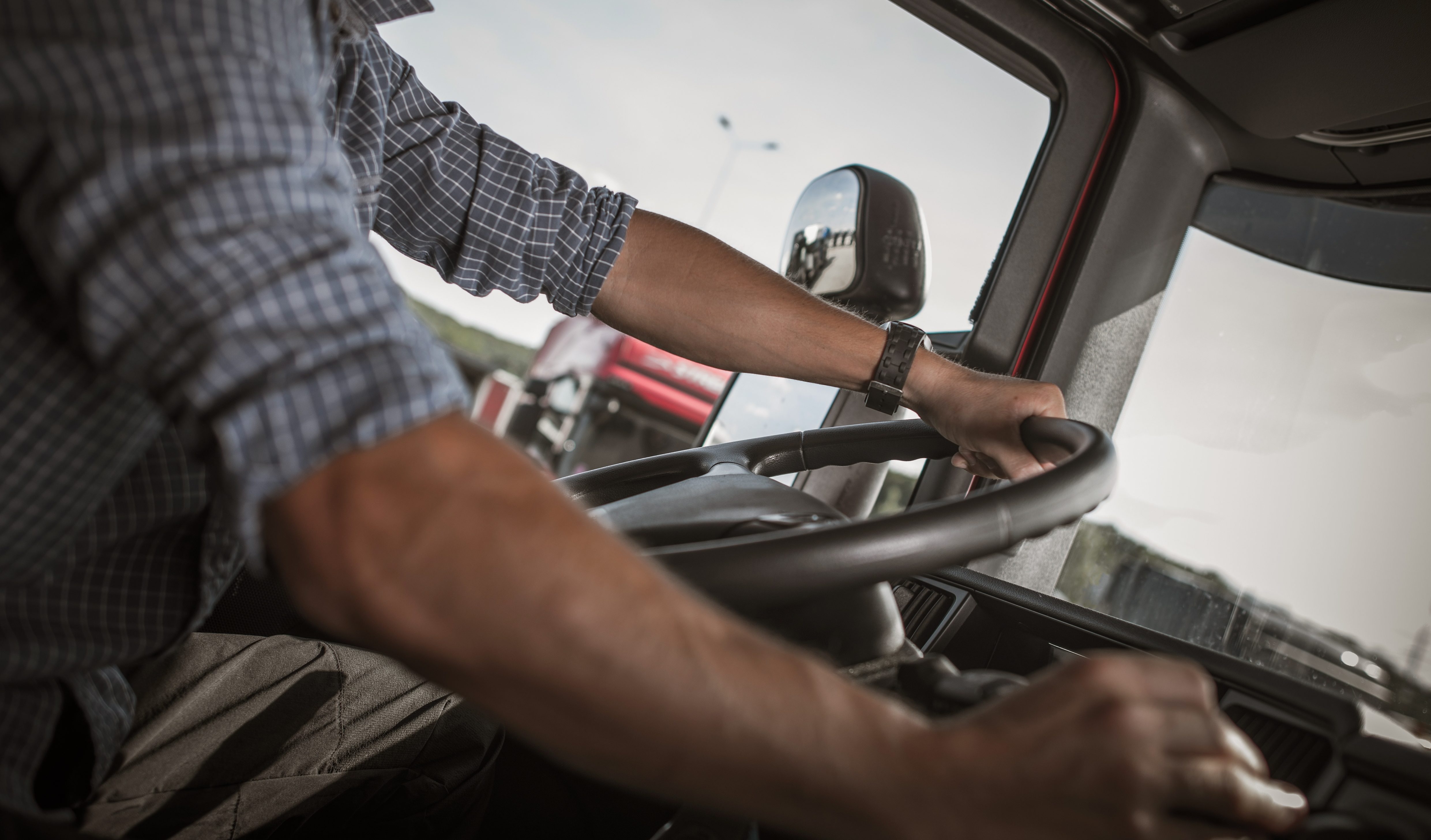 Trucker Behind the Wheel.